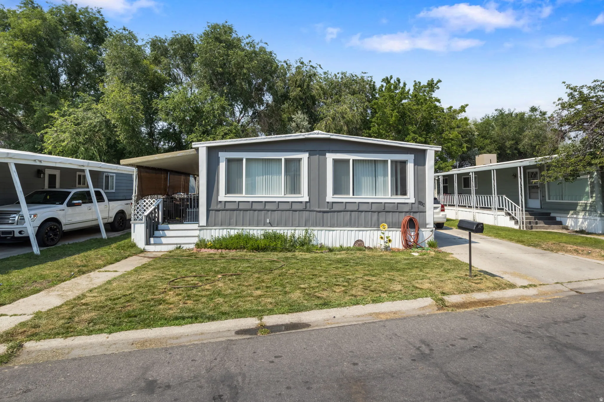 Gray siding exterior with white trim
