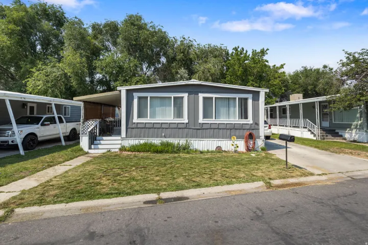 Gray siding exterior with white trim