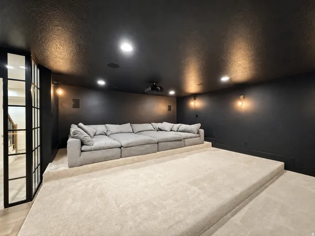 Theater room with ceiling-mounted Sony projector and surround sound