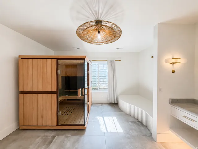 Spa room with Sauna, massage table and Steam shower