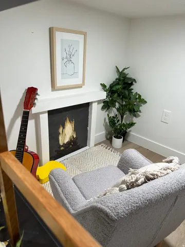 Basement 2 story play house/living room with faux fireplace