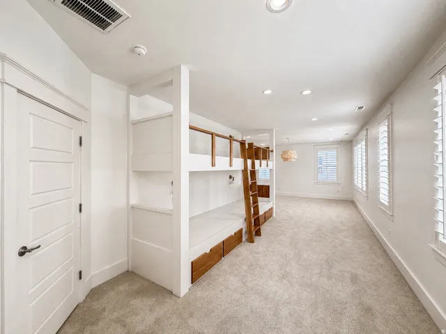 Double bunk beds (4) with storage drawers and individual reading lights