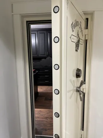 Safe room with security vault door with combination lock and multi-point locking mechanism