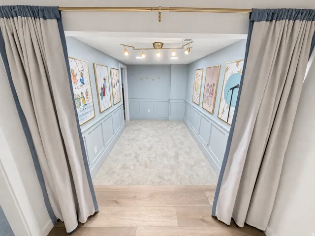 Theater/Stage room audience area with custom lighting and wainscoting.