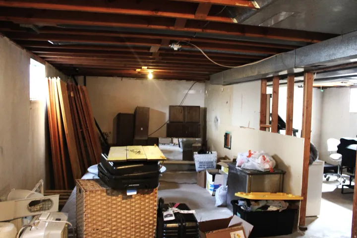 Unfinished side of basement with washer dryer hookups