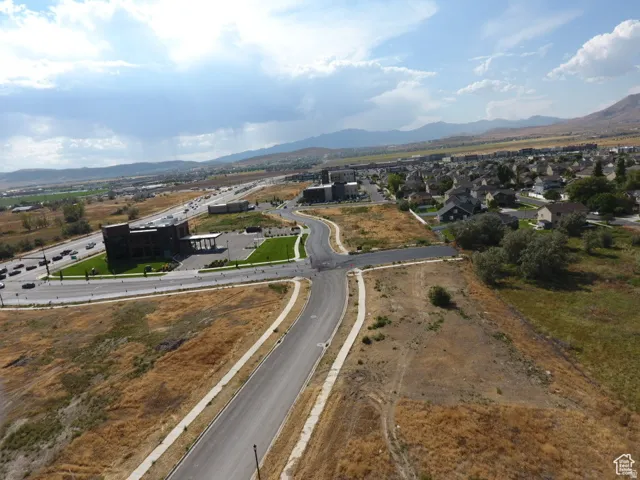 Expansive undeveloped land with newly paved roads and sidewalks