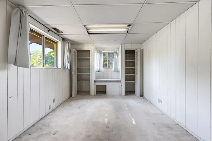 White vertical paneling on walls