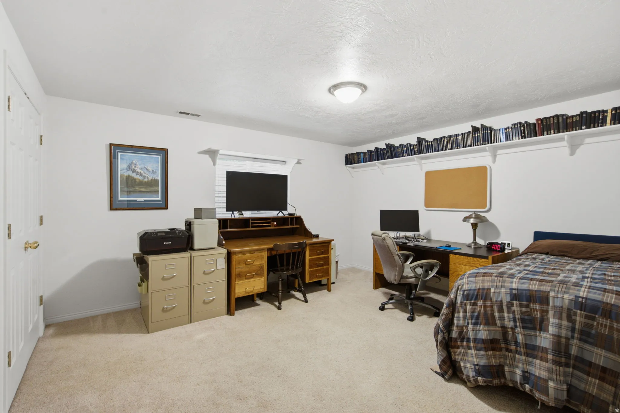 Bright room with carpeted flooring, a flush-mount ceiling light fixture, and a window with horizontal blinds