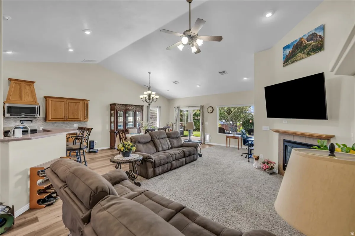 Vaulted ceilings with recessed lighting and ceiling fans