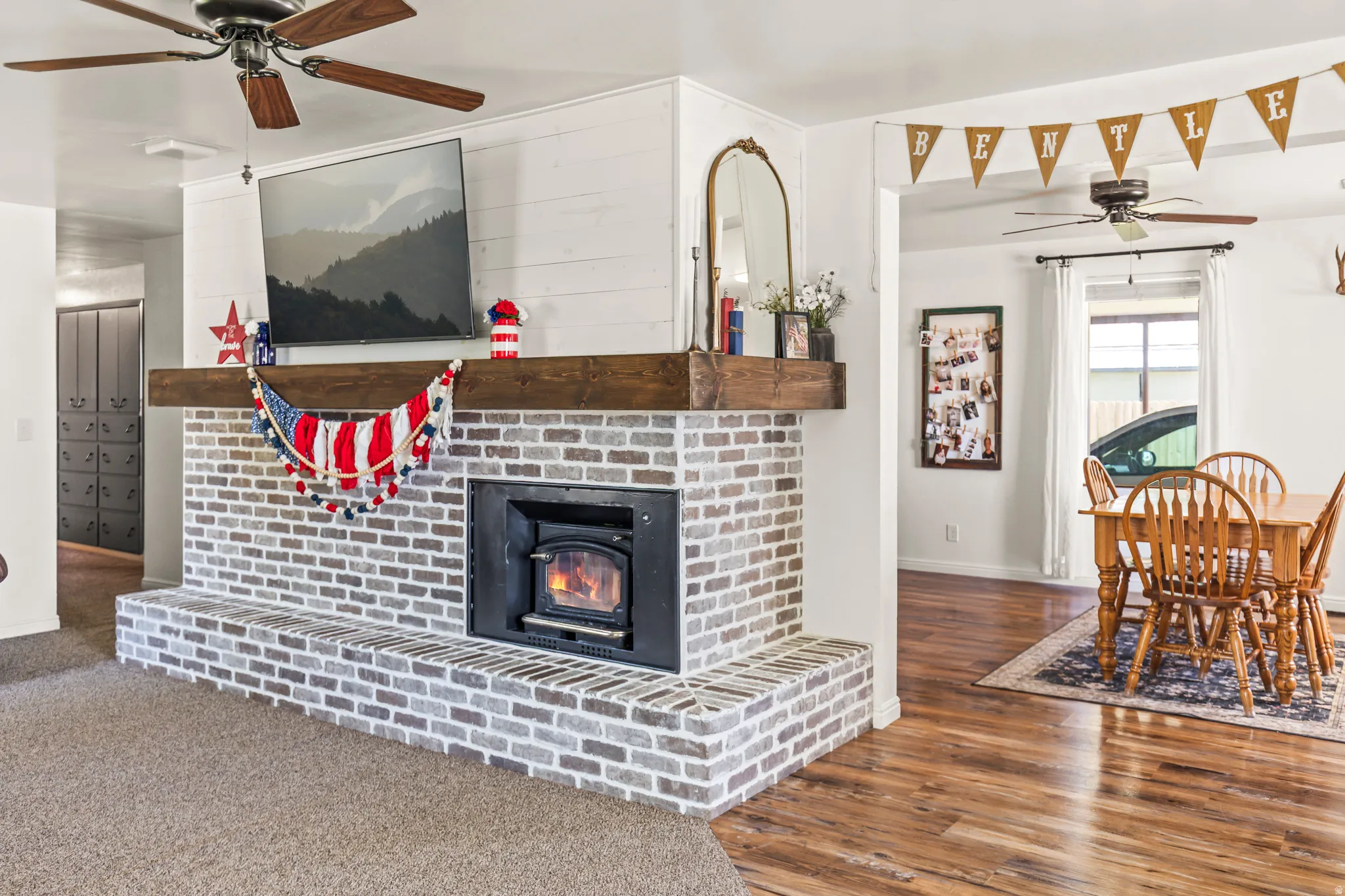 Brick fireplace with a substantial wood mantel and integrated firebox