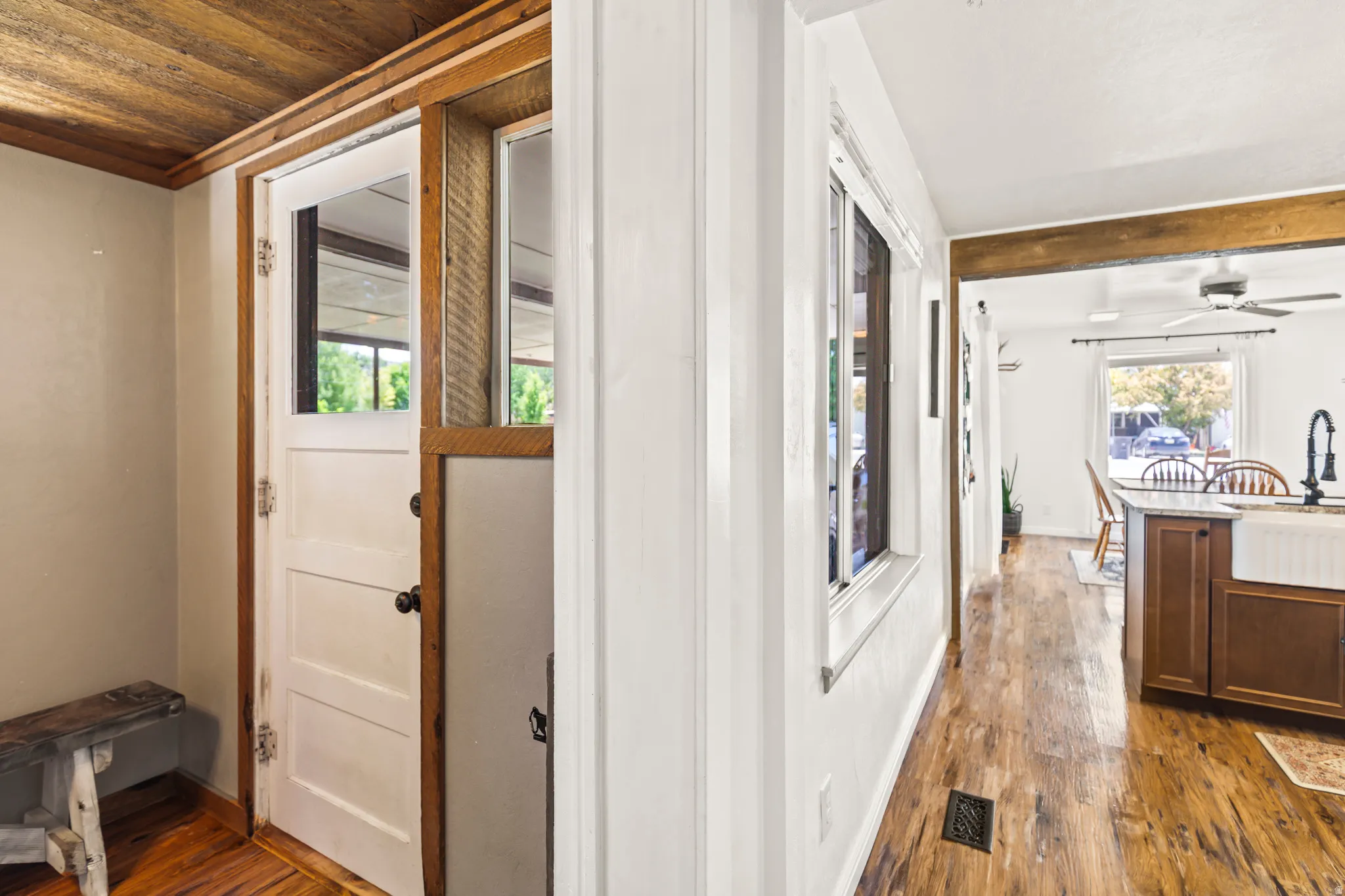 Entryway featuring a Dutch door with an upper pane, wood-finish flooring, and a wood plank ceiling