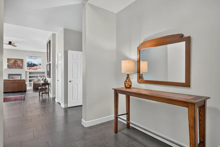 Recessed lighting and tile flooring in the entry hall