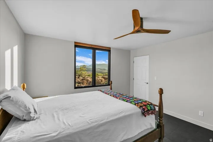 Room with dark-finish flooring and light gray walls