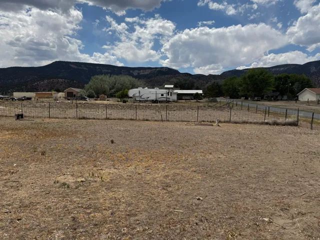 Expansive open lot with wire fencing