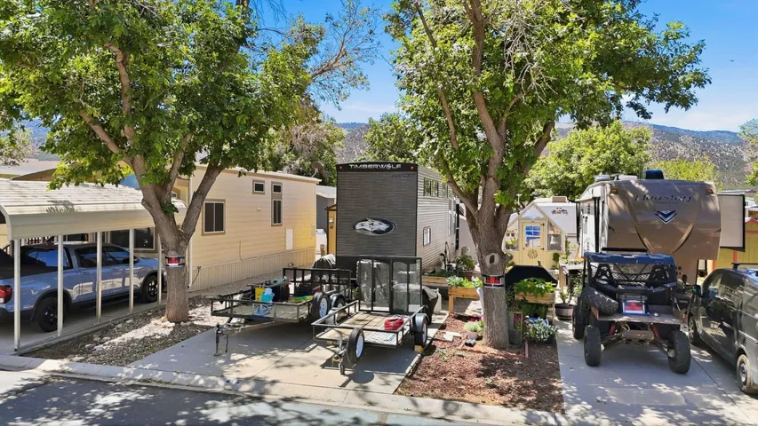 Paved driveway with an attached carport