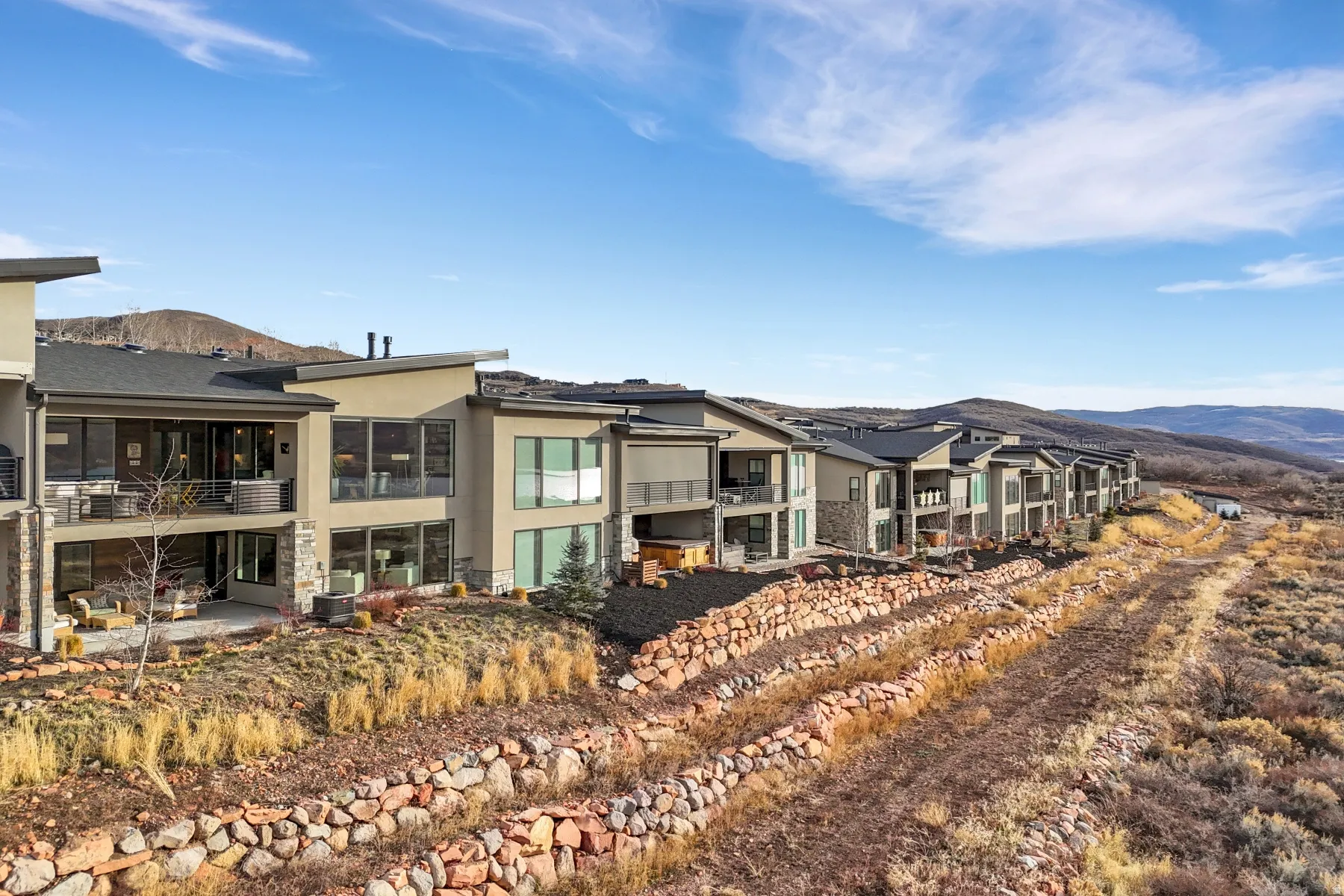 Modern residences featuring extensive window elements and private balconies