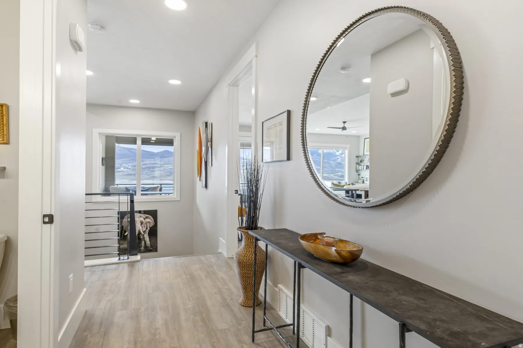 Hallway featuring wood-finish flooring and recessed lighting