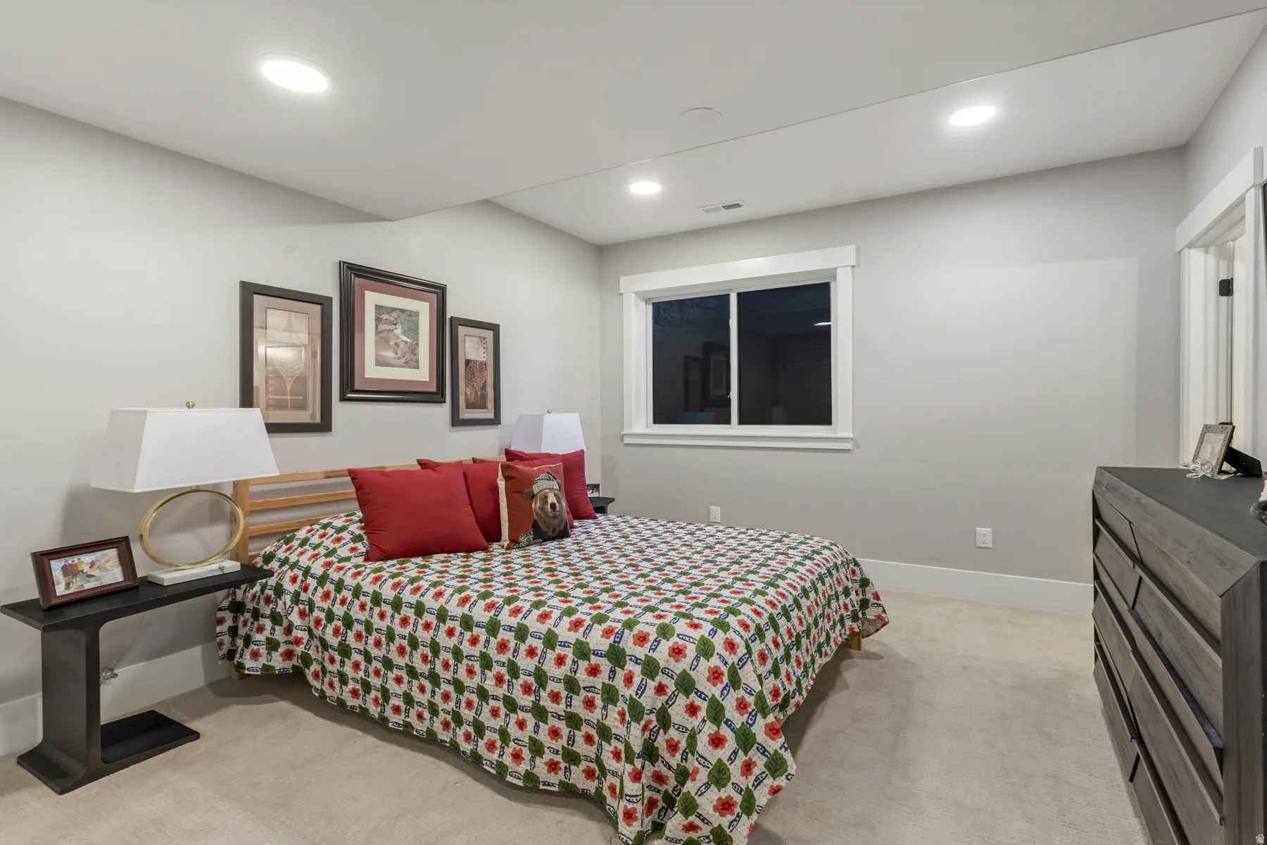Wall-to-wall carpeting and neutral wall tones create a serene atmosphere