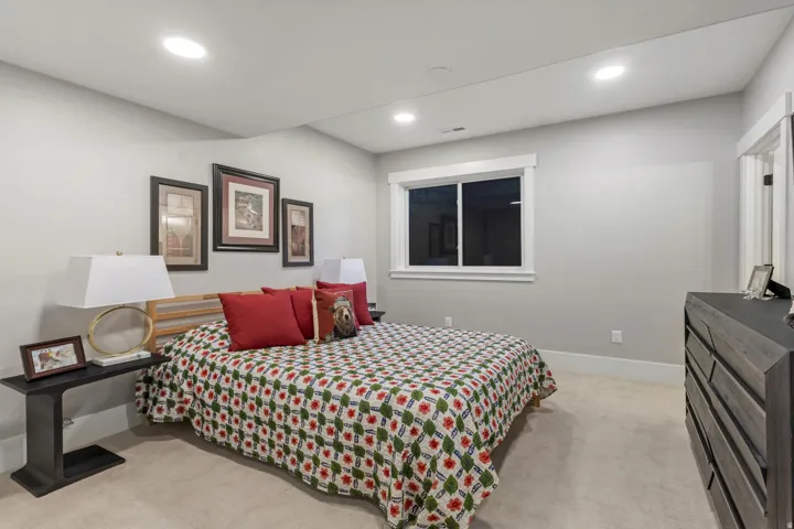 Wall-to-wall carpeting and neutral wall tones create a serene atmosphere