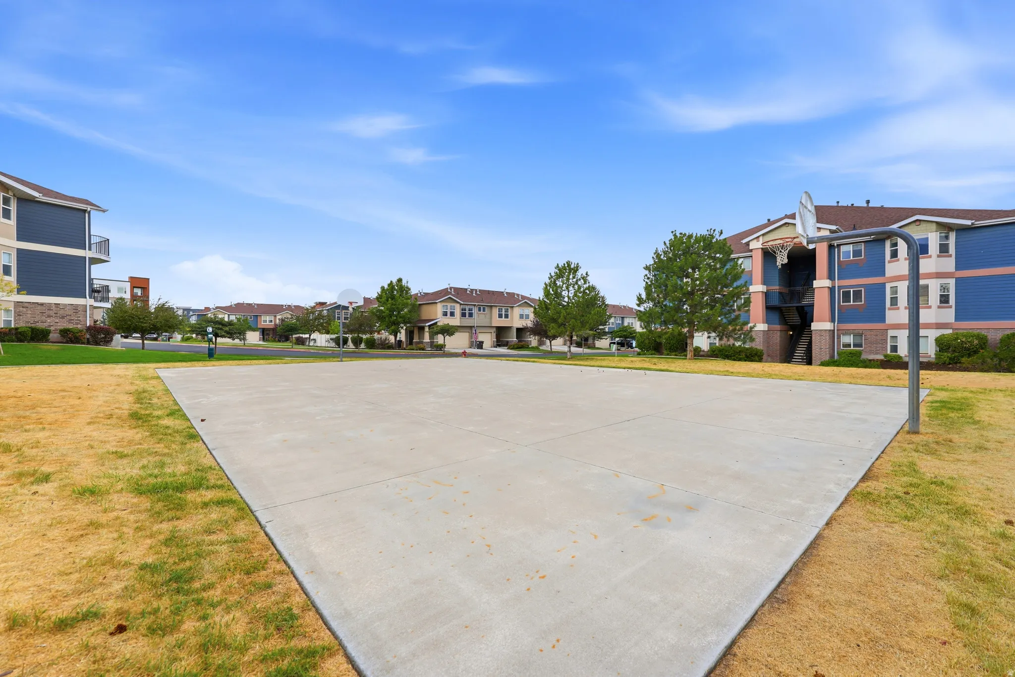 Outdoor concrete court with a basketball hoop