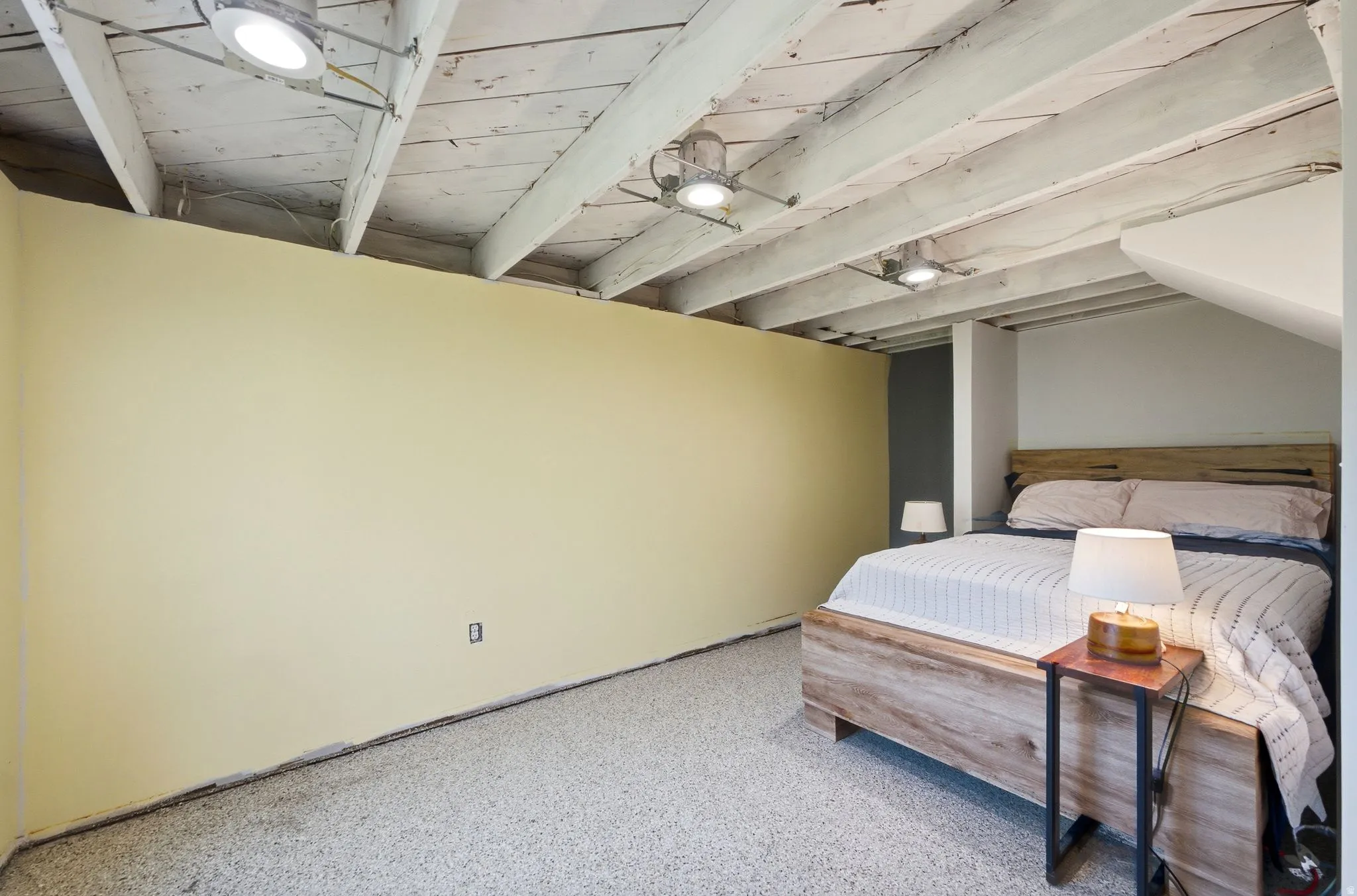 Exposed ceiling beams with recessed lighting