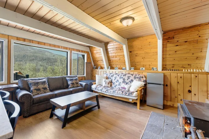 Expansive window wall overlooking mountainous terrain