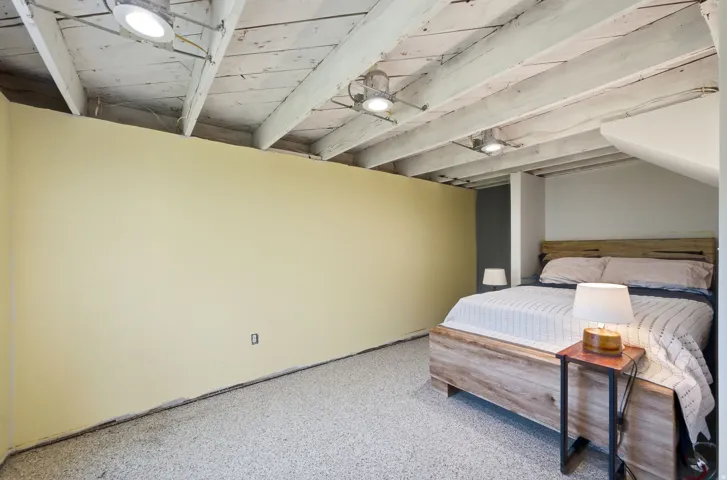 Exposed ceiling beams with recessed lighting
