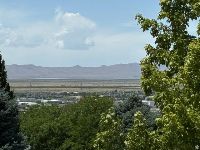 Expansive landscape with a distant horizon and mountainous terrain