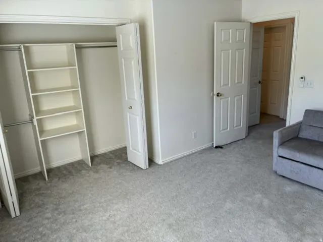 Wall-to-wall carpeting and neutral wall tones