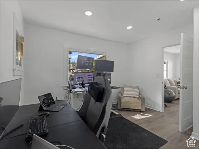 Home 2/2 - 938 E Herbert Avenue -- Bright room featuring recessed lighting, a window with exterior views, light wood-finish flooring, and white trim