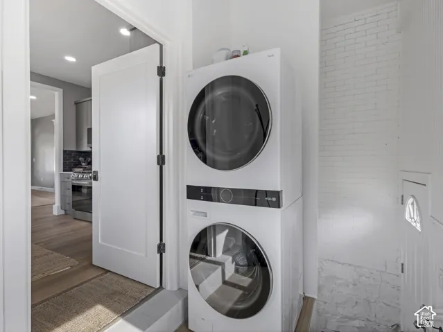 Home 1/2 -- 1046 S Lincoln Street -- Stacked laundry appliances featuring clear appliance doors and dark control panels