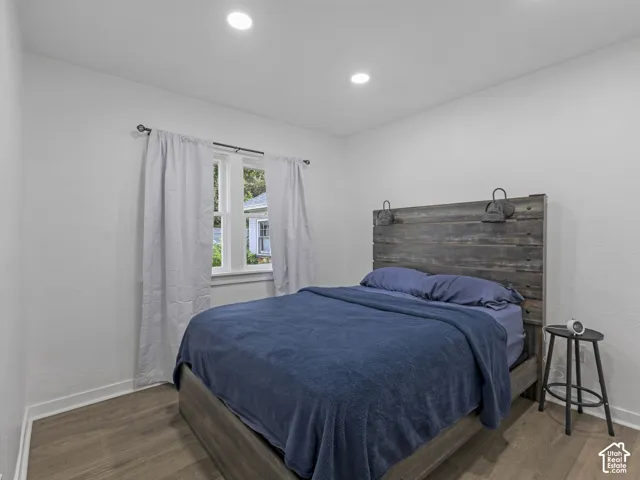 Home 2/2 - 938 E Herbert Avenue --Bedroom featuring recessed ceiling lighting, wood-finish flooring, and white baseboards