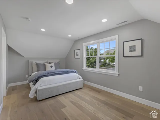 Home 1/2 -- 1046 S Lincoln Street -- Spacious room featuring wood-finish flooring, a double window with white trim, and recessed lighting
