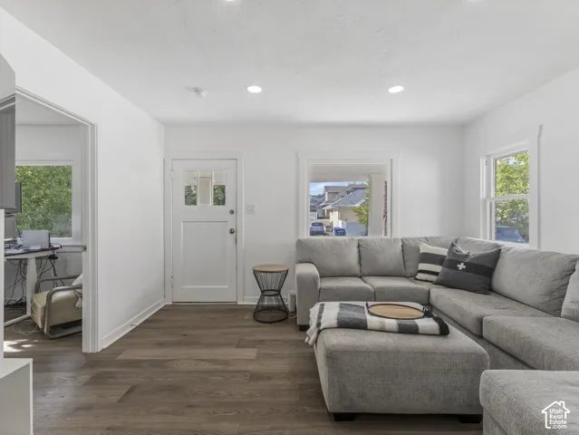 Home 2/2 - 938 E Herbert Avenue -- Living area featuring wood-finish flooring, recessed lighting, white walls, and a white paneled entry door with glass inserts