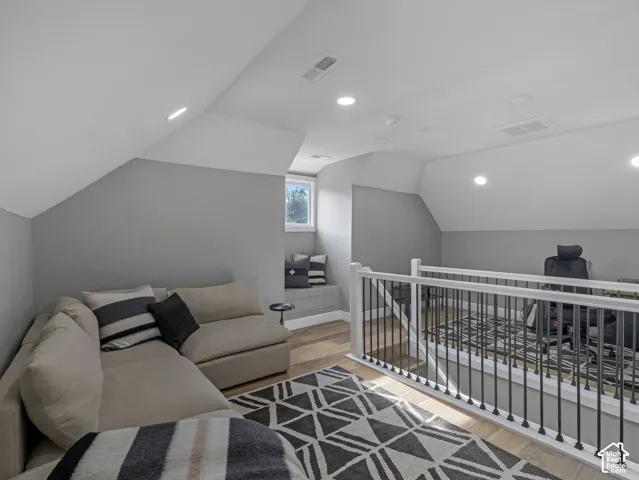 Home 1/2 -- 1046 S Lincoln Street -- Loft space featuring wood-finish flooring, recessed lighting, and a white railing with black balusters