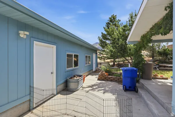Blue siding exterior with multiple windows