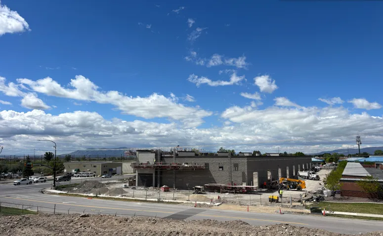 Commercial building under construction with exposed brick and concrete block walls