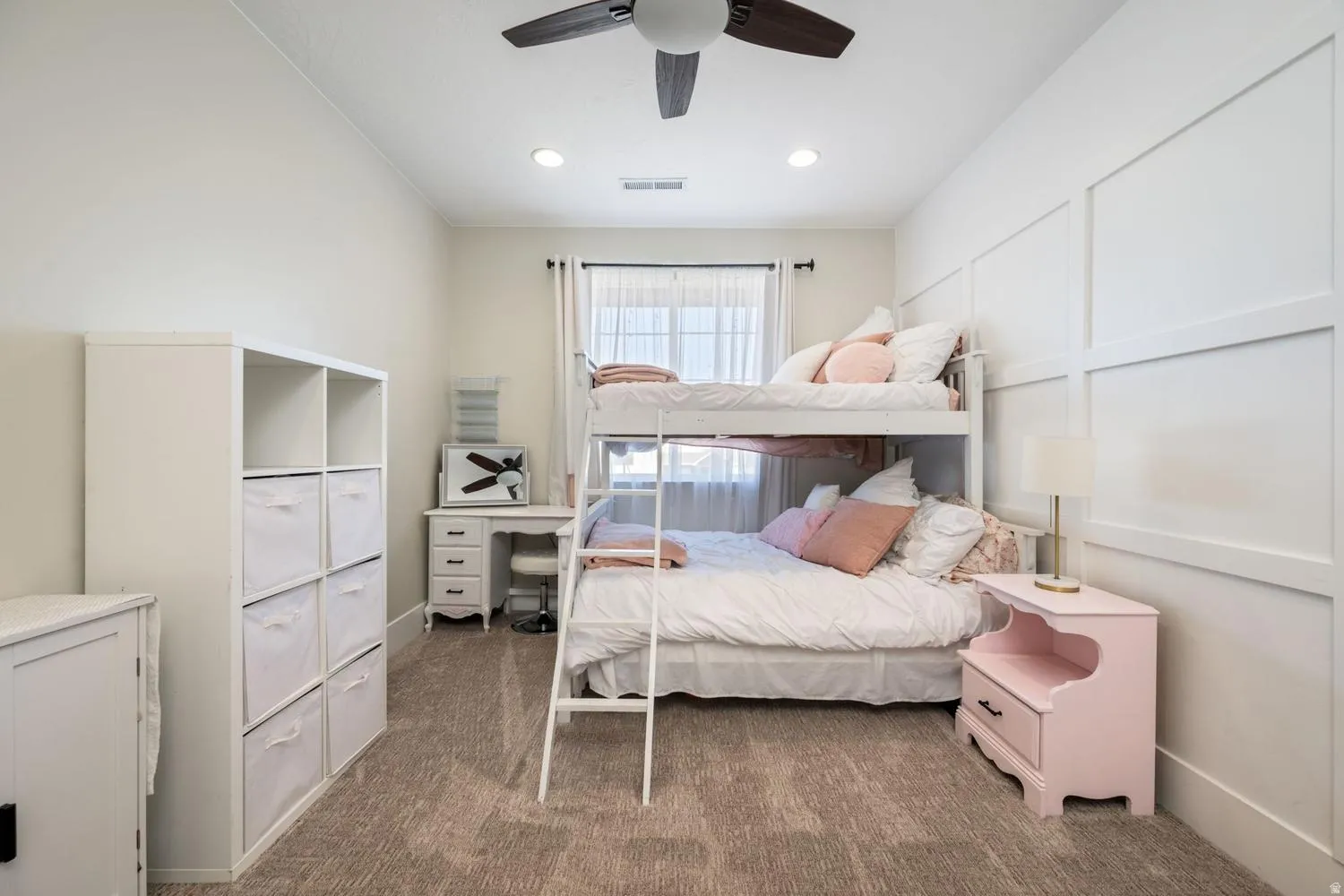 Bedroom featuring textured carpeting, a window with sheer curtains, a ceiling fan, and recessed lighting