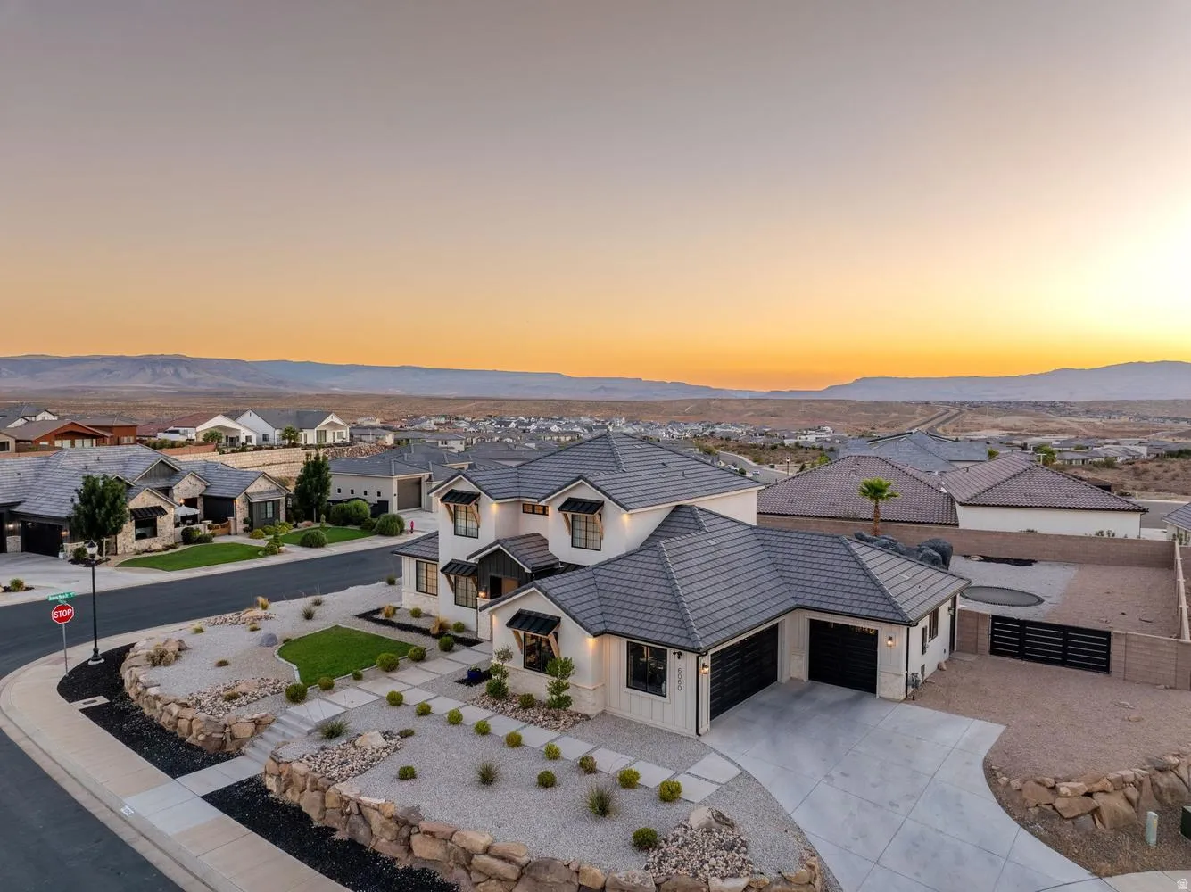 Contemporary two-story residence with a multi-gabled roof and a spacious driveway