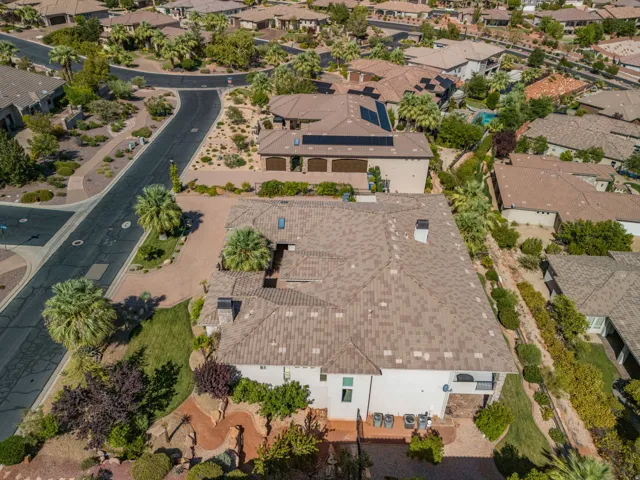 Expansive property featuring a multi-level architectural design, a tiled roofing system, and desert-adapted landscaping