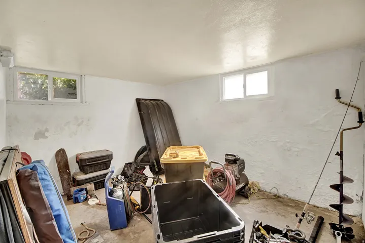 Basement area featuring concrete flooring and painted walls
