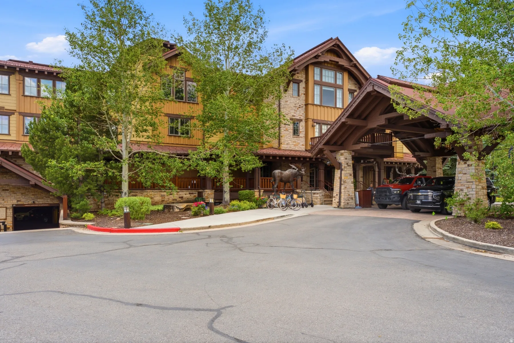 Craftsman-style facade featuring stone and wood siding