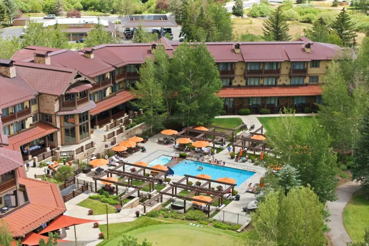 Expansive resort-style property featuring multiple buildings with red roofs and numerous balconies