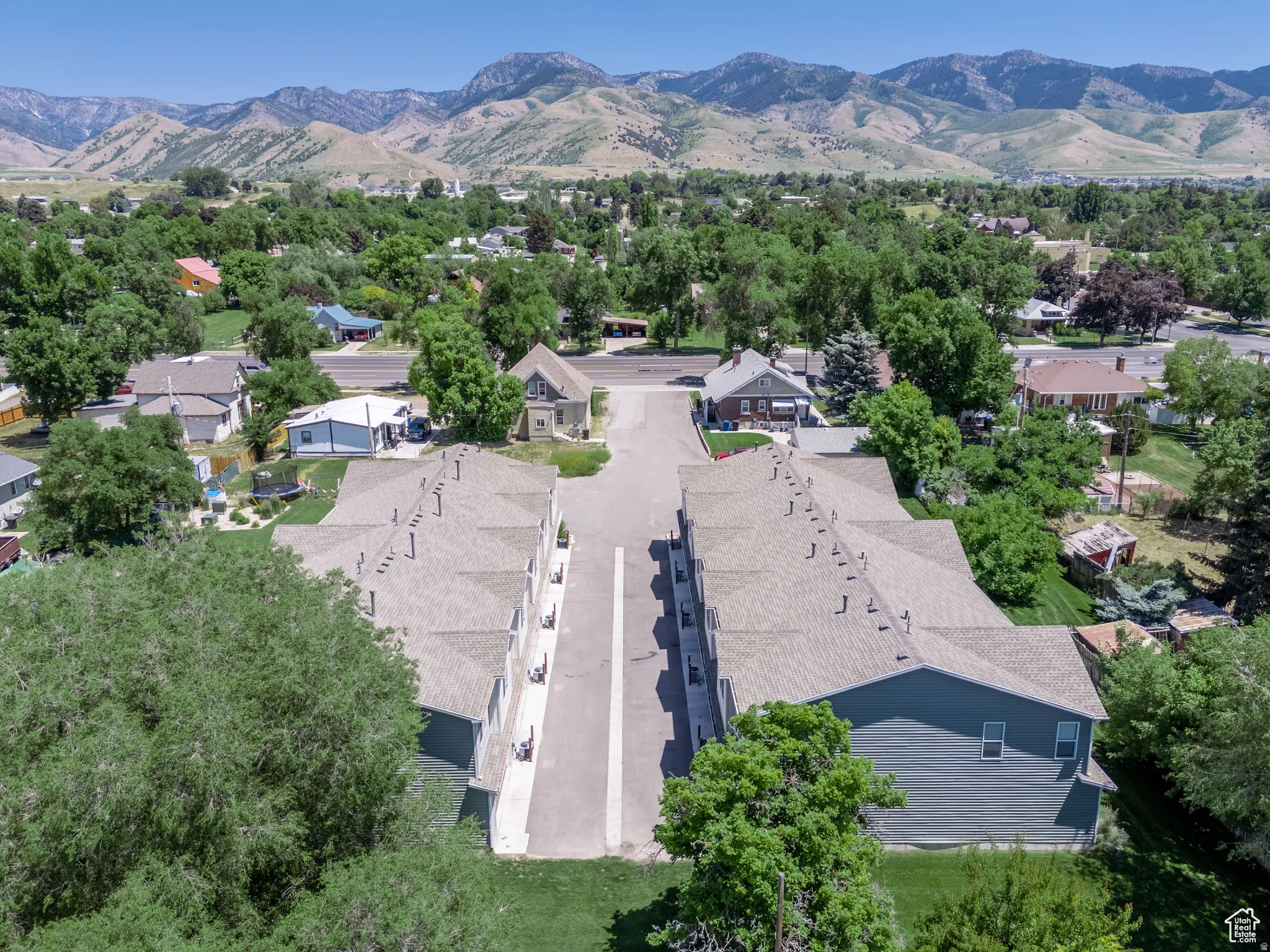 Multi-unit property with a central paved driveway