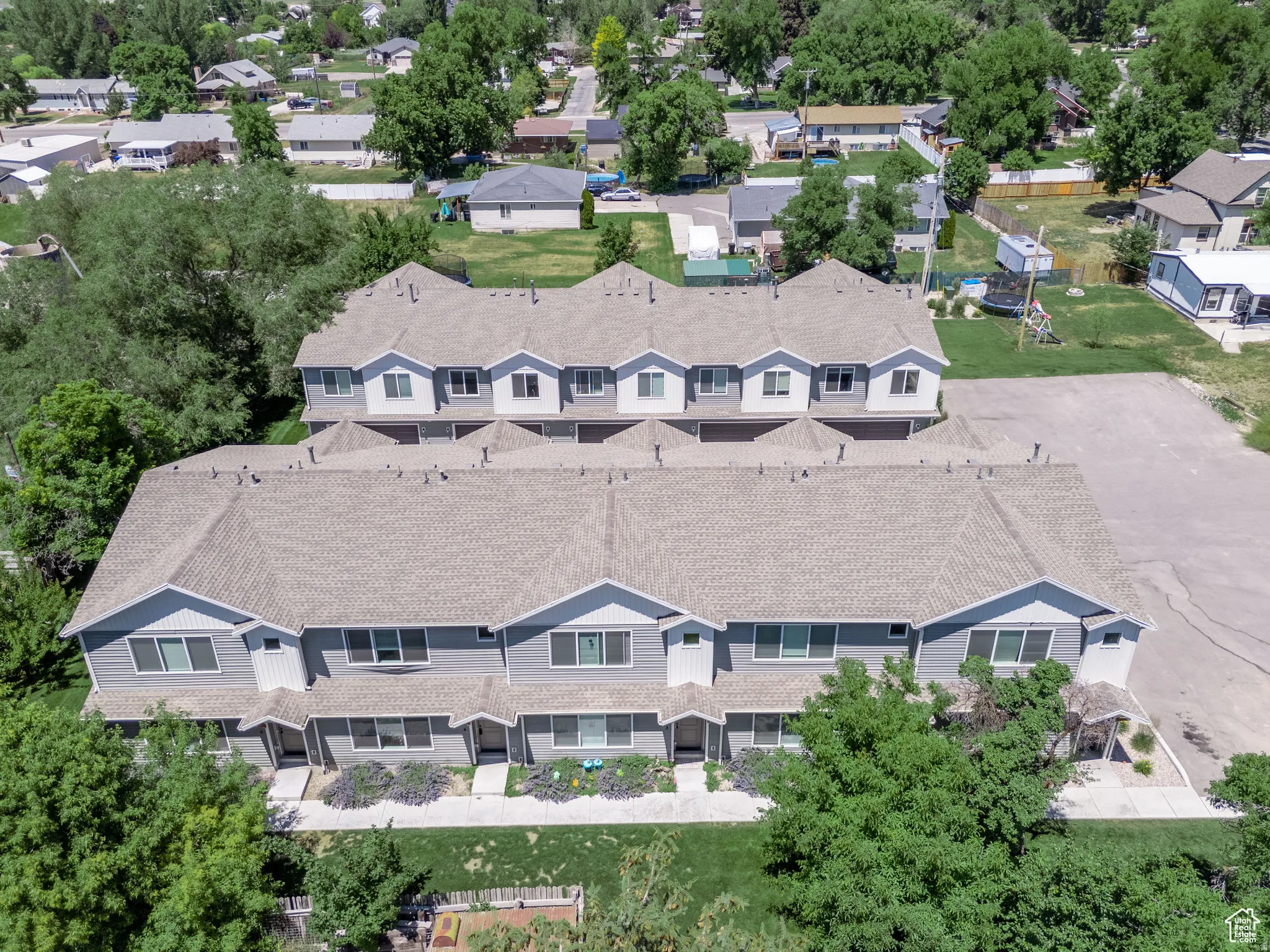 Aerial perspective showcasing two parallel rows of multi-unit residential structures