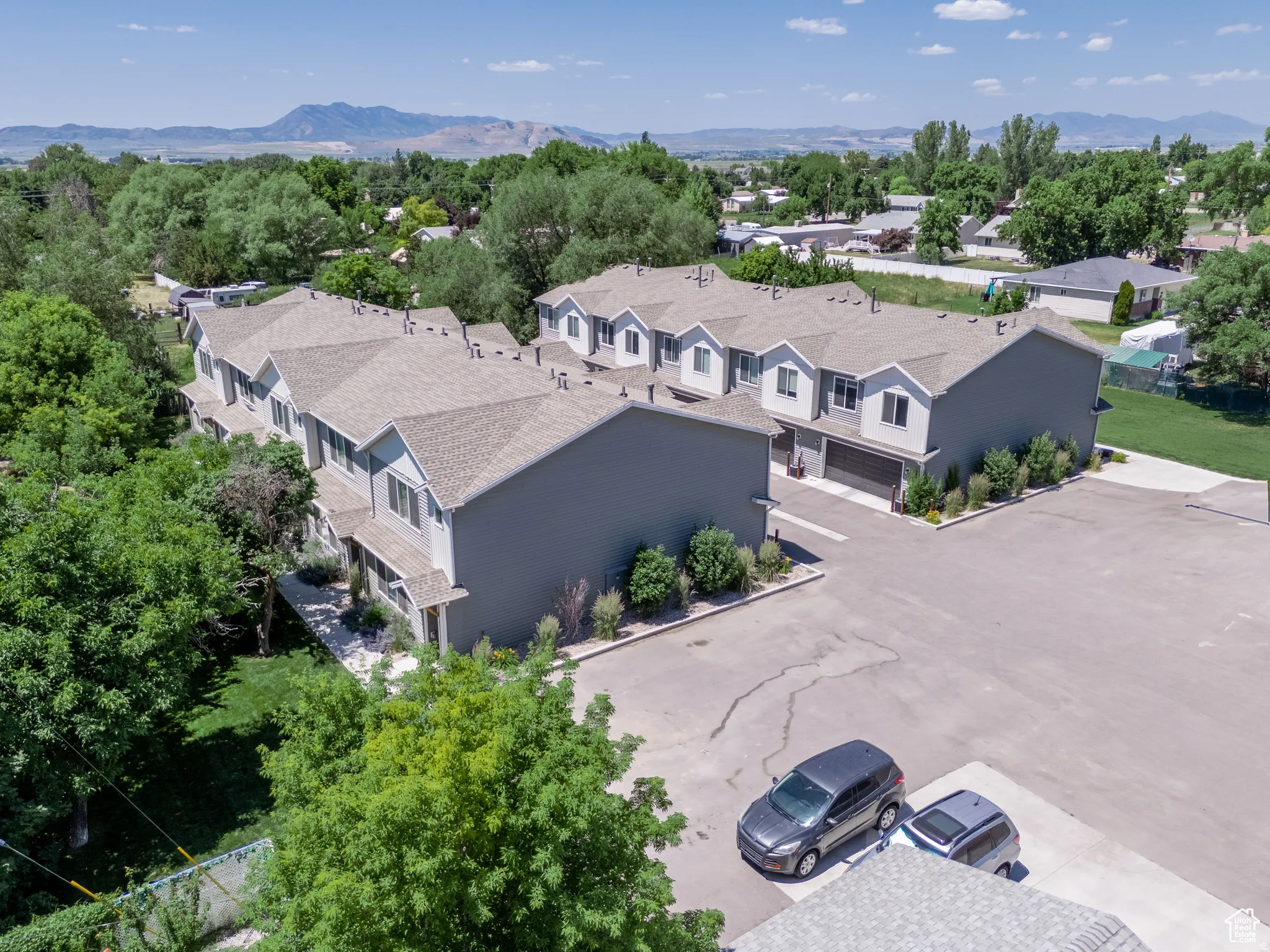 Modern townhome community featuring multiple units with individual garages and private entrances