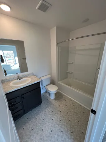 Bathroom with hexagon tile flooring