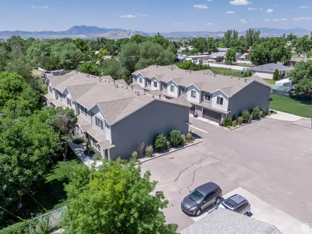 Modern townhome community featuring multiple units with individual garages and private entrances