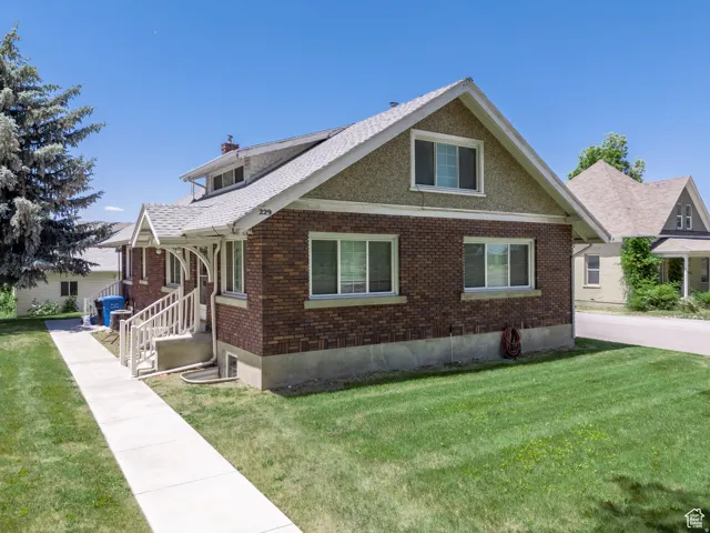 Brick and stucco exterior with a pitched roofline