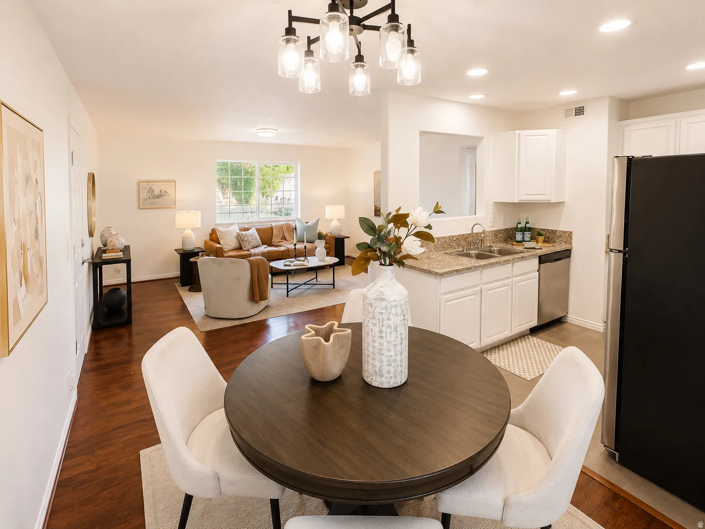 Open-concept living area featuring wood-finish flooring